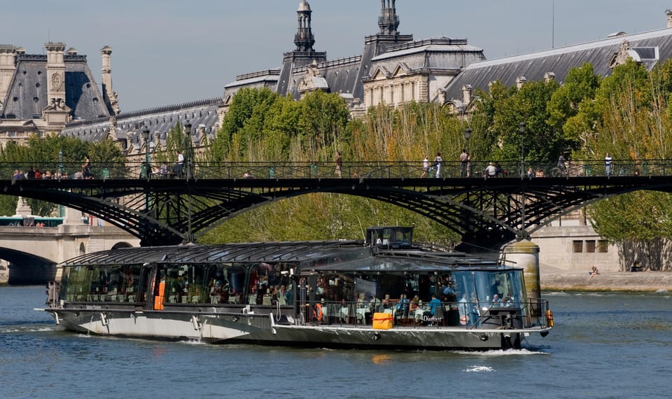 From London: Paris Tour with Sightseeing Bus & Lunch Cruise - River Seine lunch cruise: live music, traditional food, and big views